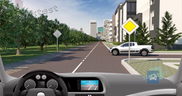 Как Вы будете действовать, двигаясь по главной дороге, если приближающийся по второстепенной дороге легковой автомобиль не останавливается?